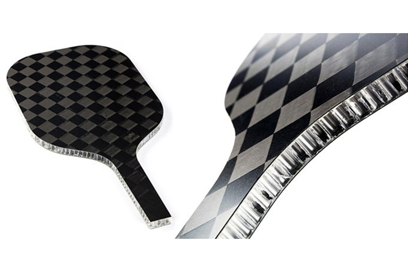 Carbon fiber pickleball paddle highlighting lightweight construction and performance